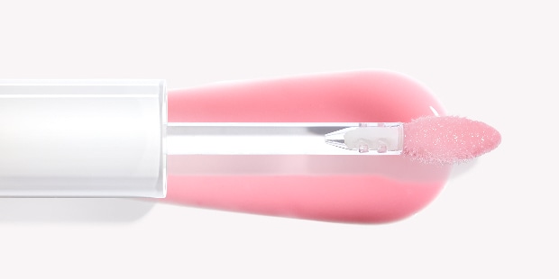 Close up of Long-Wear Cream Shadow Stick with swatch behind on top of a soft-grey background